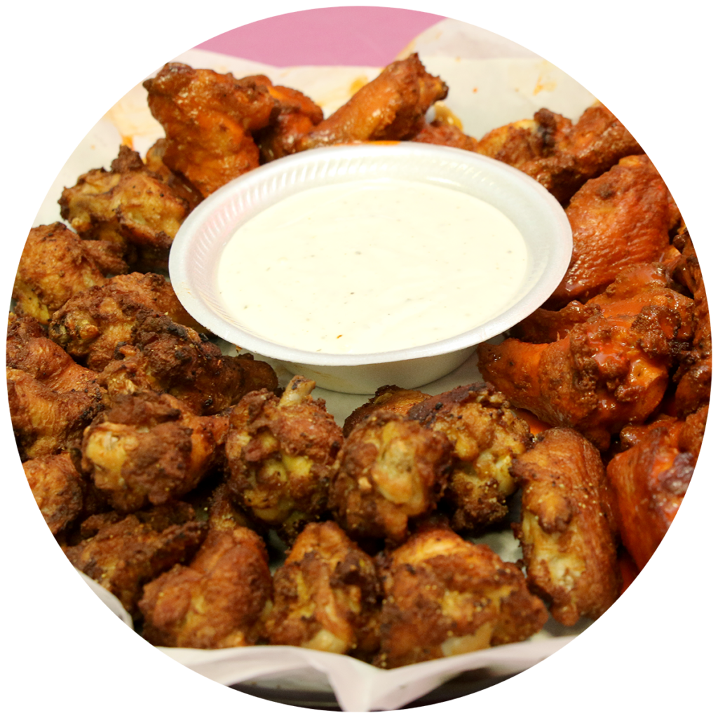 Bowl of boneless chicken wings served with ranch dipping sauce